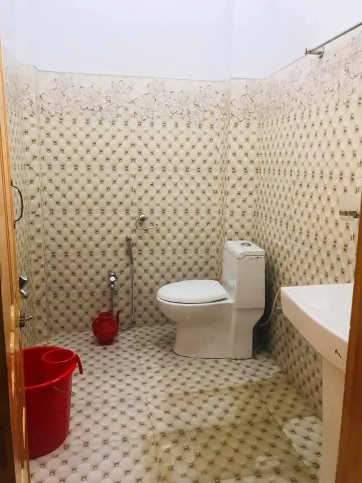 Attached bathroom with hot water fittings