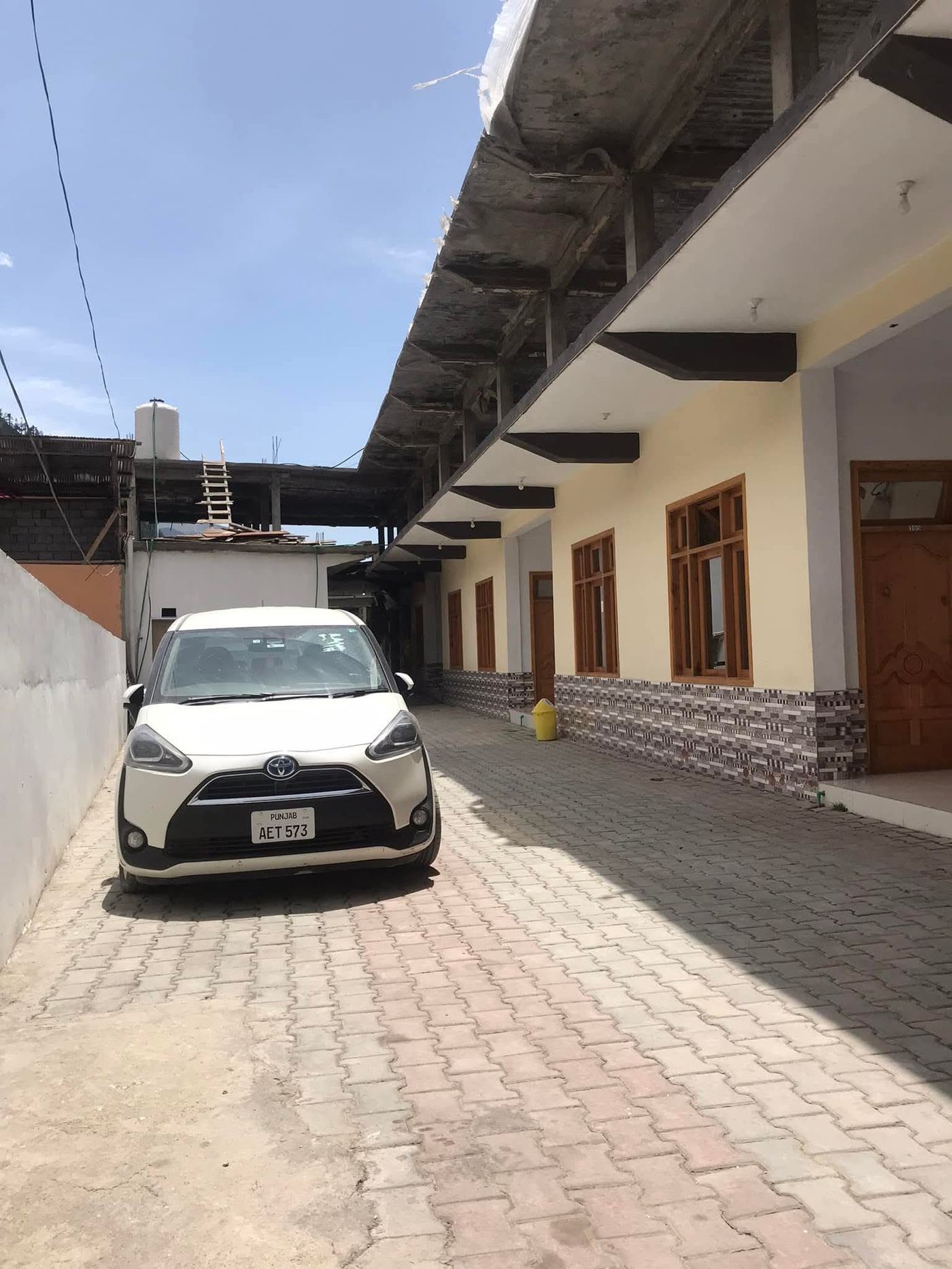 Hotel exterior corridor with car parking